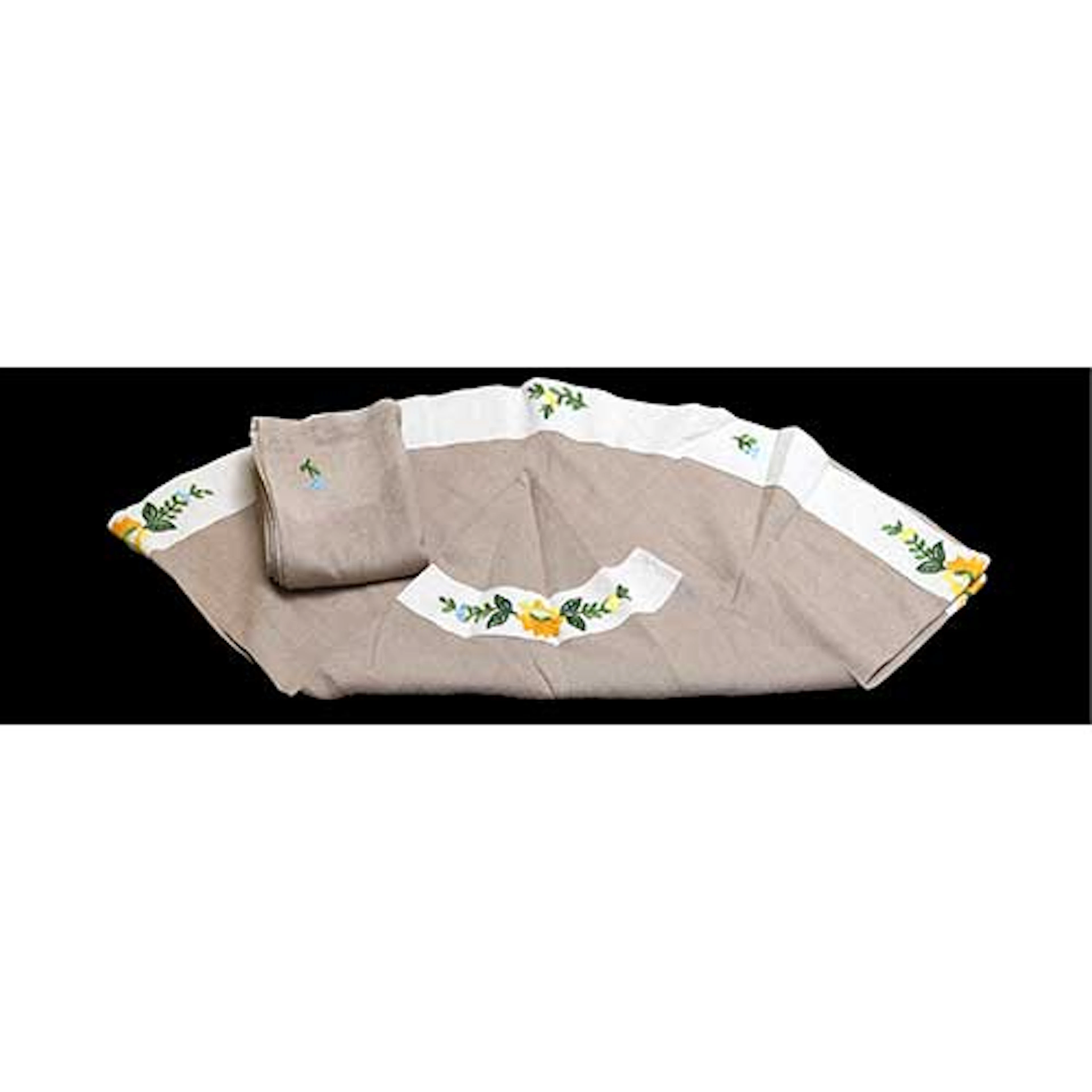 Mantel redondo con motivos florales bordados y ocho servilletas.