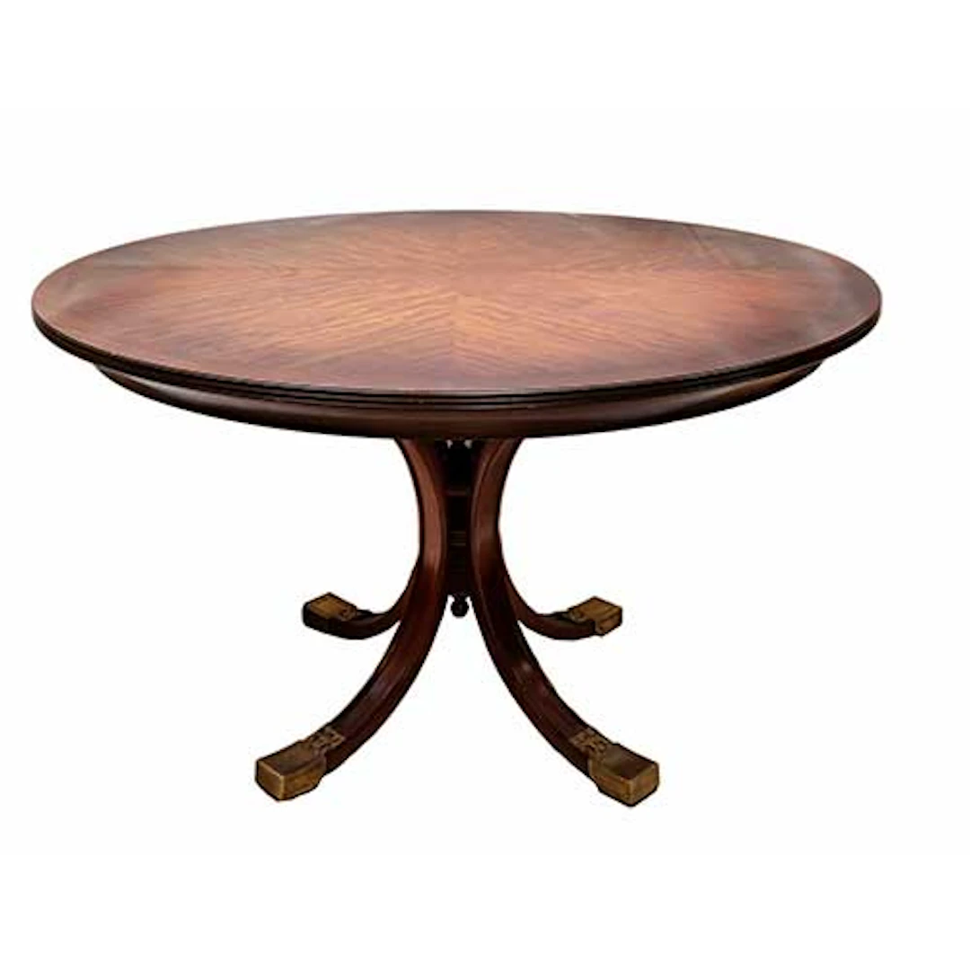 Mesa redonda de comedor con pie central y cuatro patas rematadas con