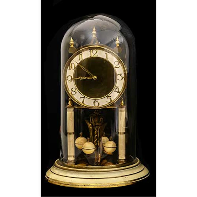 Reloj de pndulo giratorio con fanal.