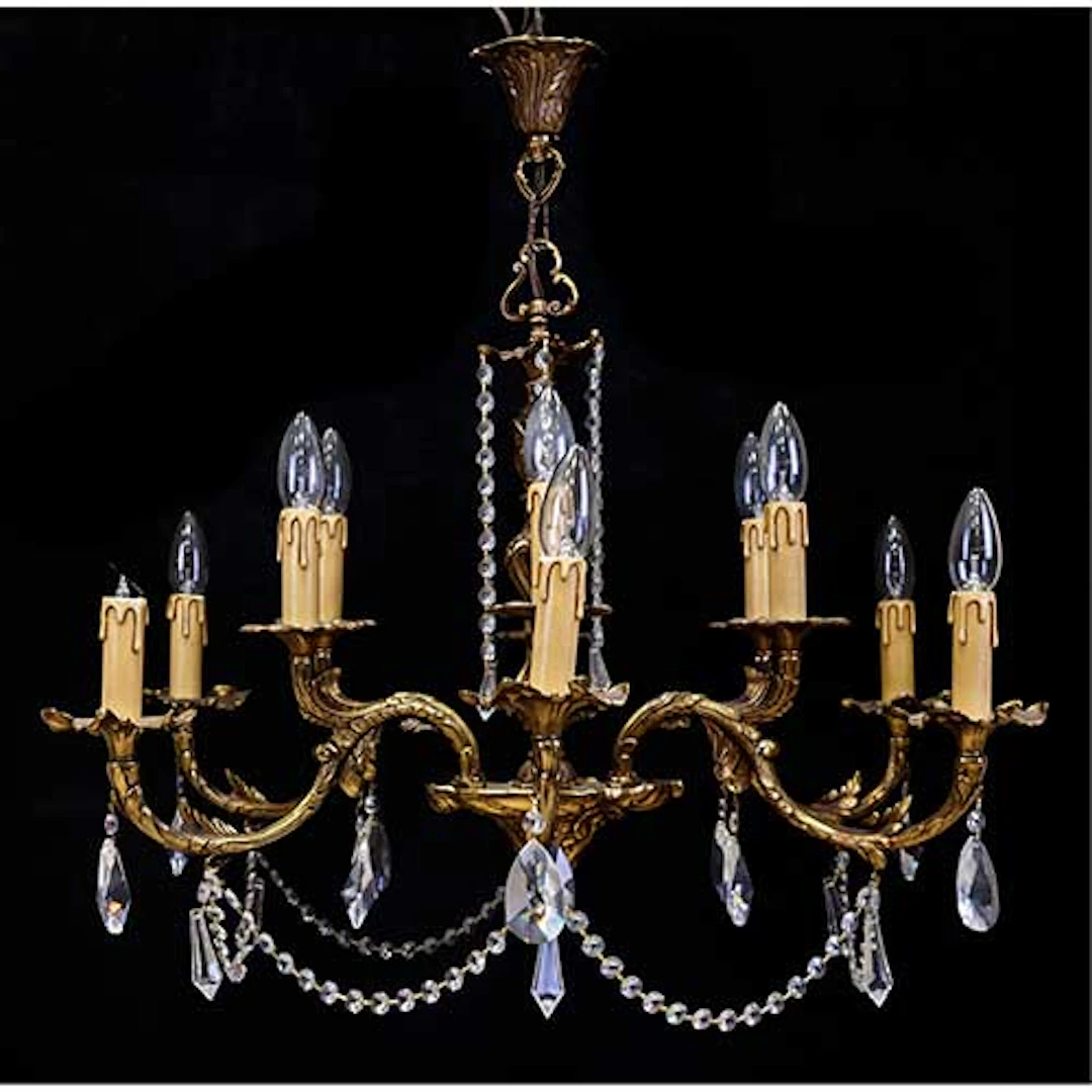 Lmpara de techo en bronce y cristal de doce luces. Con pinjantes de cristal.