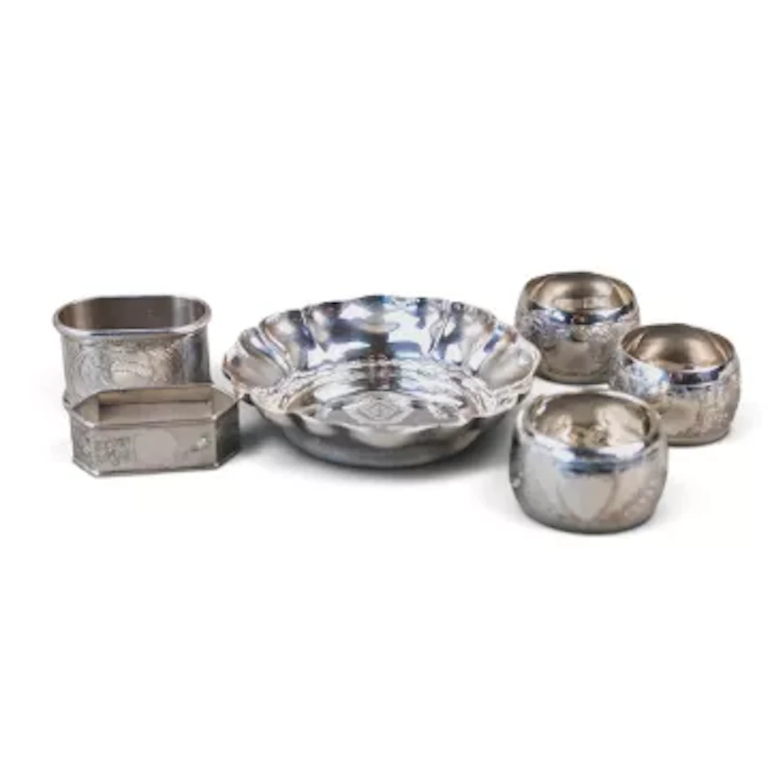 A collection of silver, including shaped commemorative dish and five