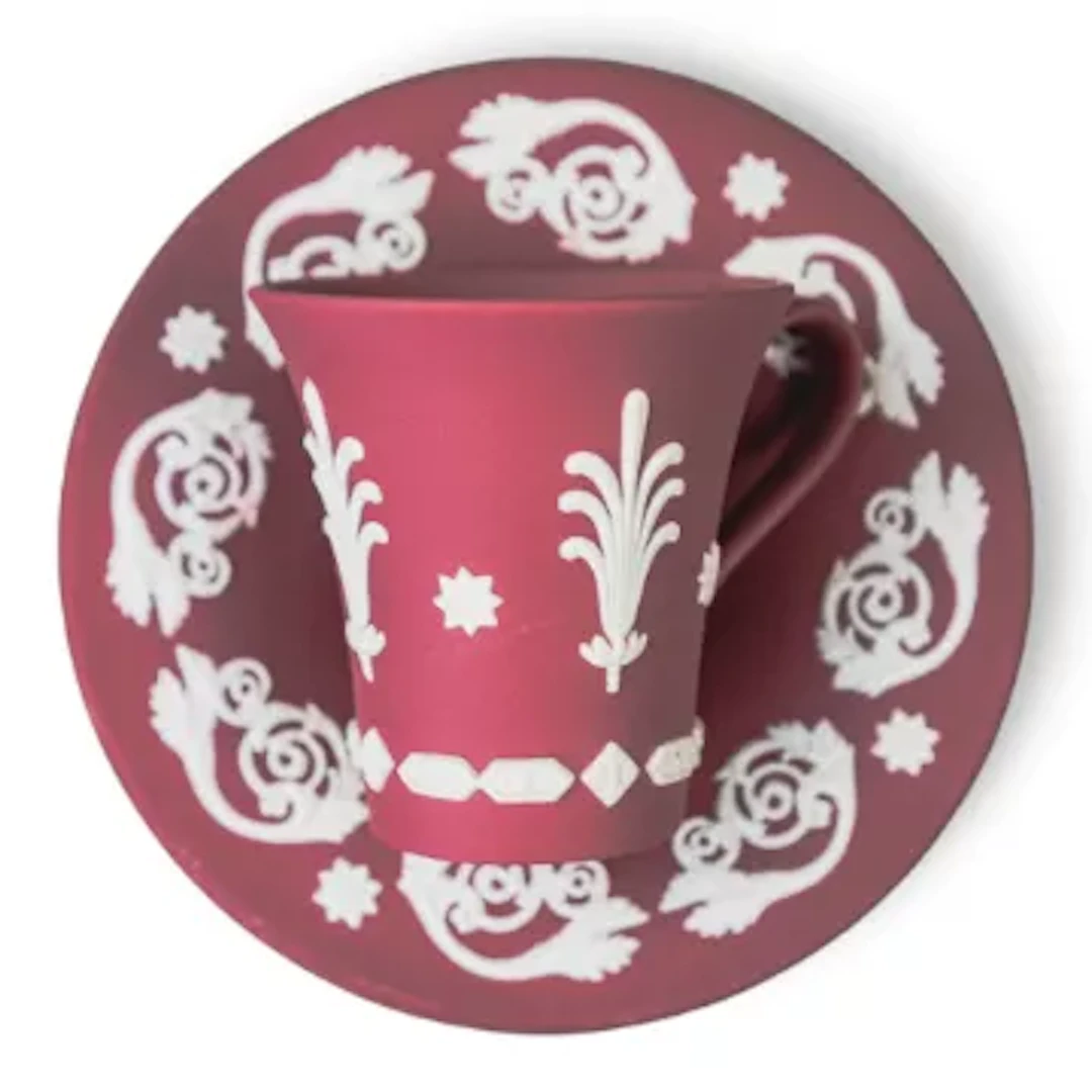 A rare Wedgwood white on crimson Jasper Japanesque cup and saucer.