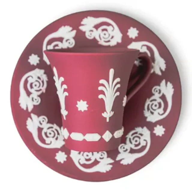 A rare Wedgwood white on crimson Jasper Japanesque cup and saucer.