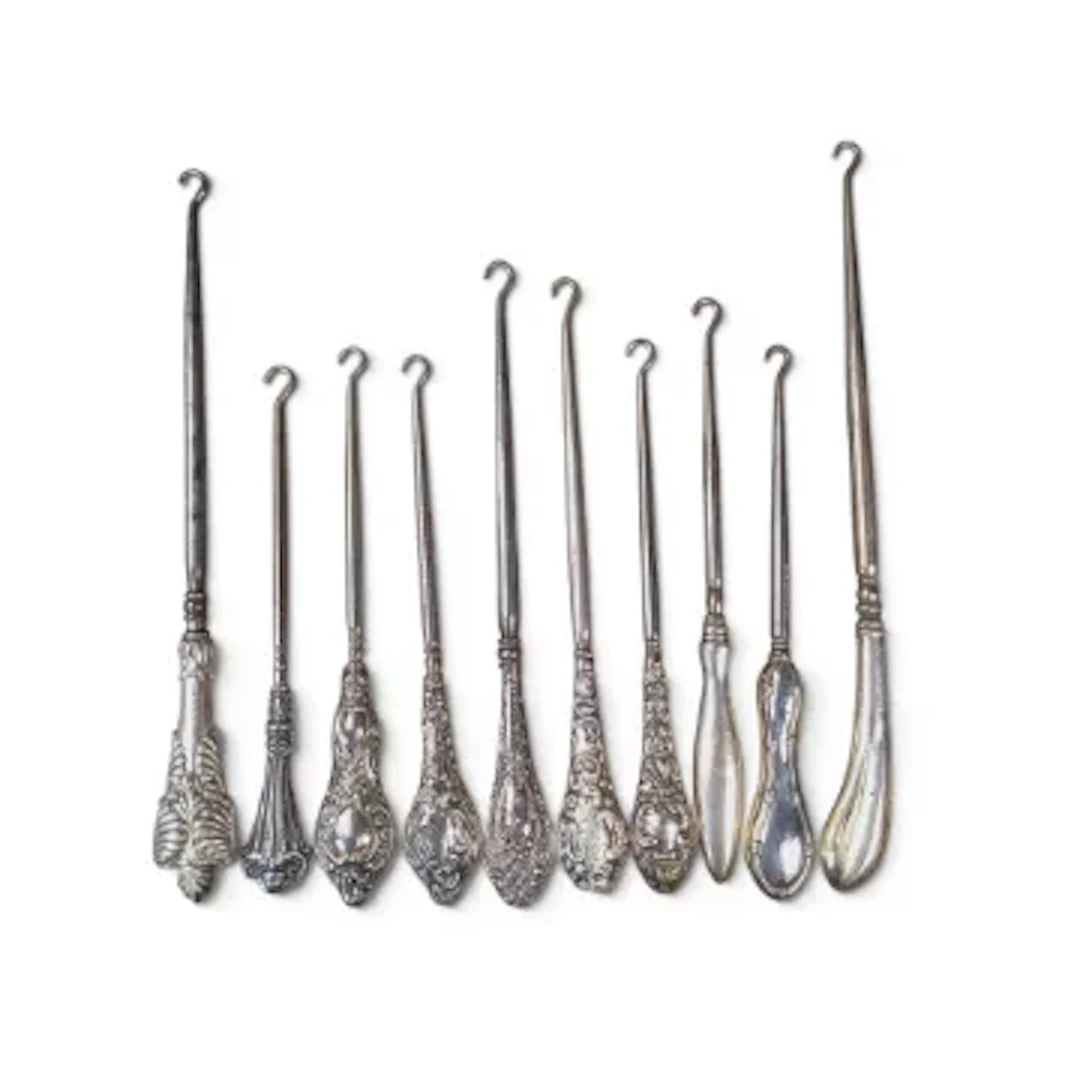 10 x hallmarked silver handled (loaded) button hooks, part of a large