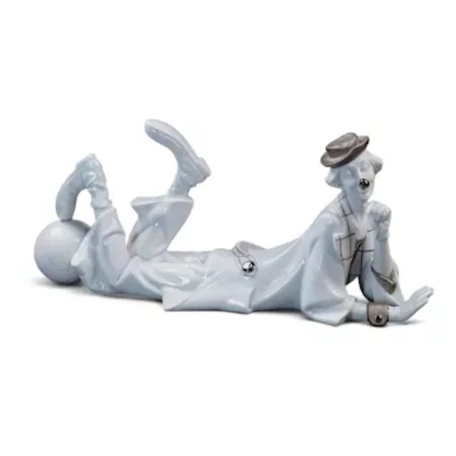 A Lladro figure The Recumbent Clown, model no.4618, designed by Salvador