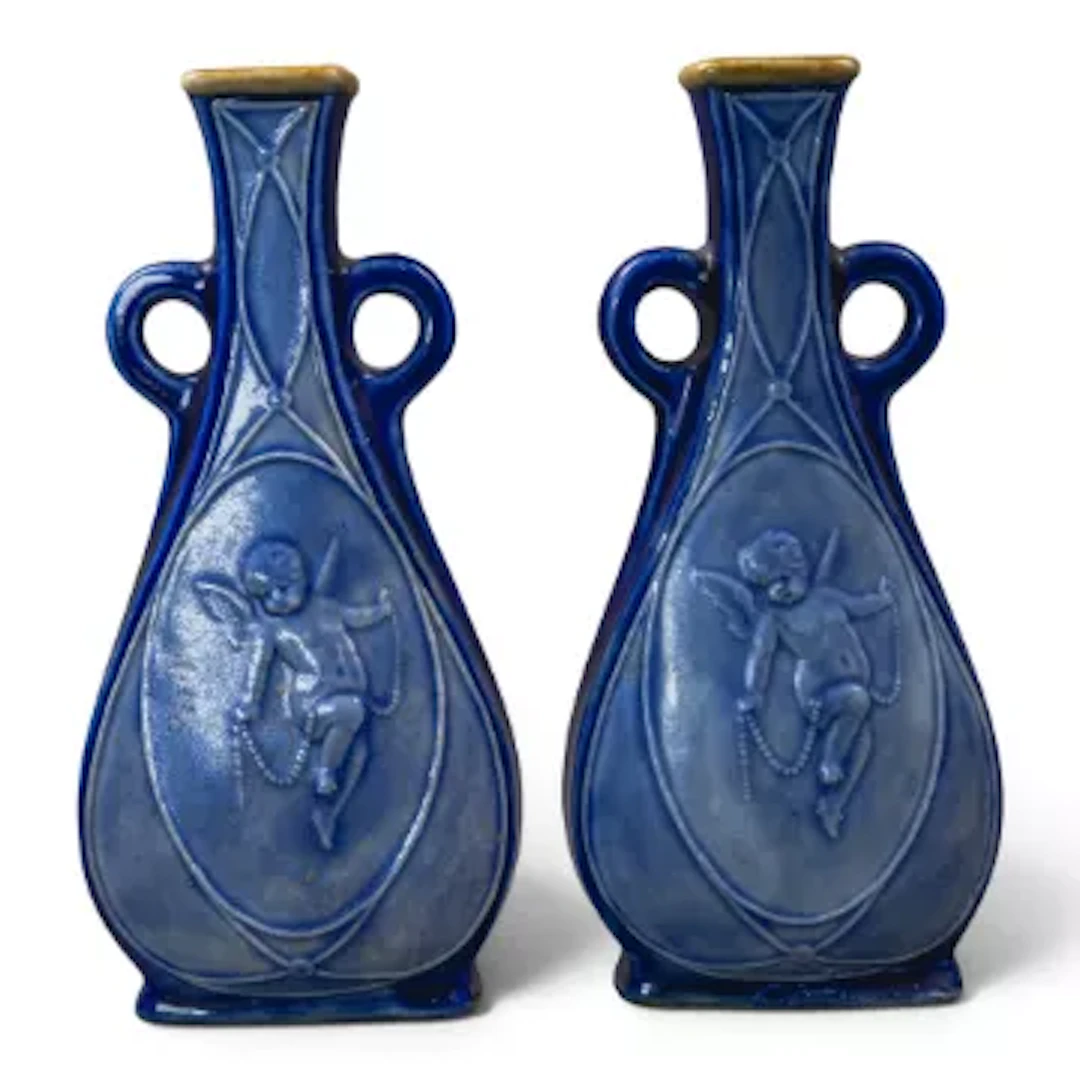 A pair of Doulton Lambeth ware stoneware twin handled flask type vases