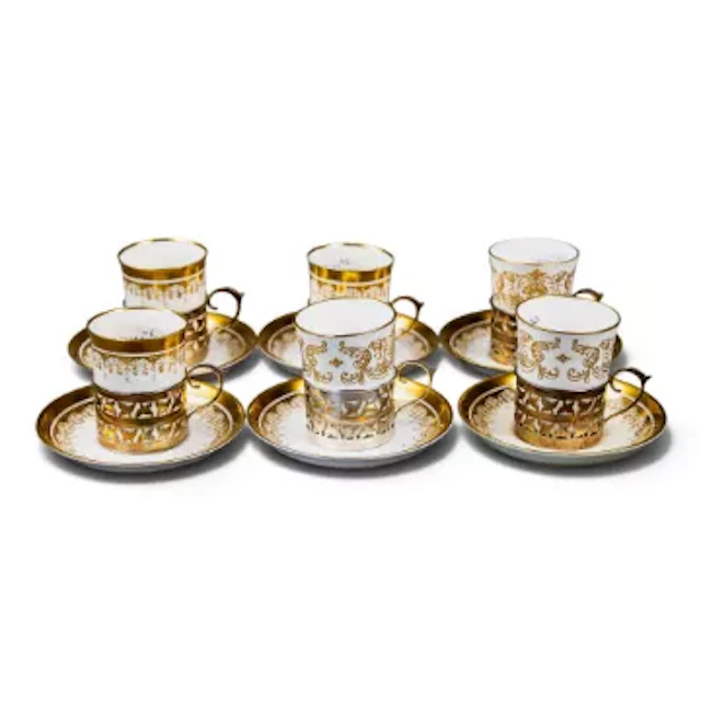 A group of 6 cups & saucers each with hallmarked silver cup holders
