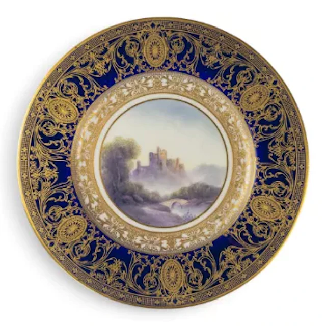 A Royal Worcester plate decorated with landscape scene of Caergwrle