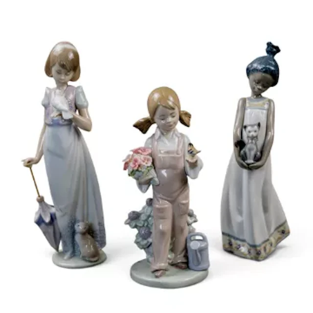 A group of three Lladro figures to include 'Summer Stroll' model 7611