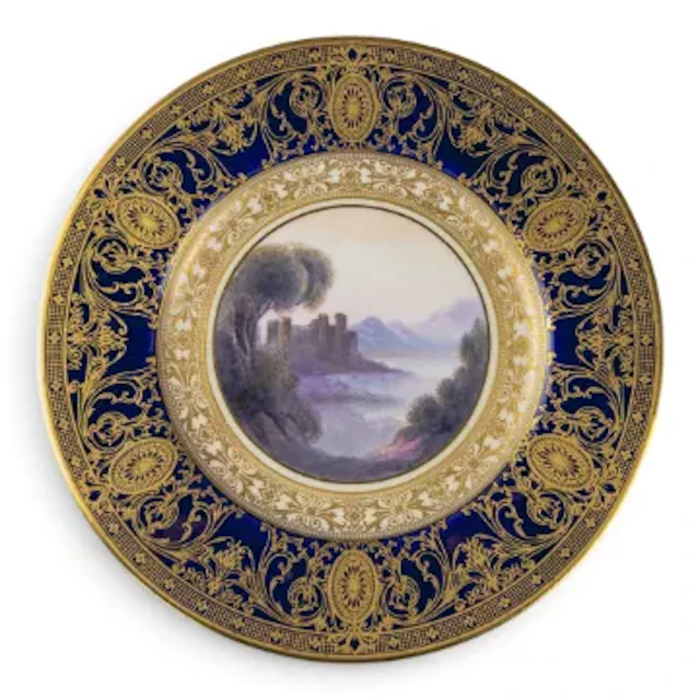 A Royal Worcester plate decorated with landscape scene of Caldicot