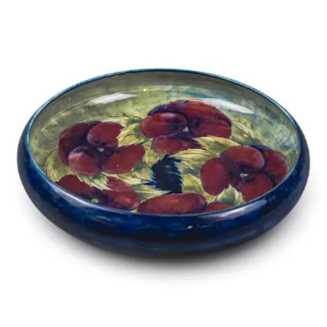 A large Moorcroft bowl in an early version of the Pansy design by