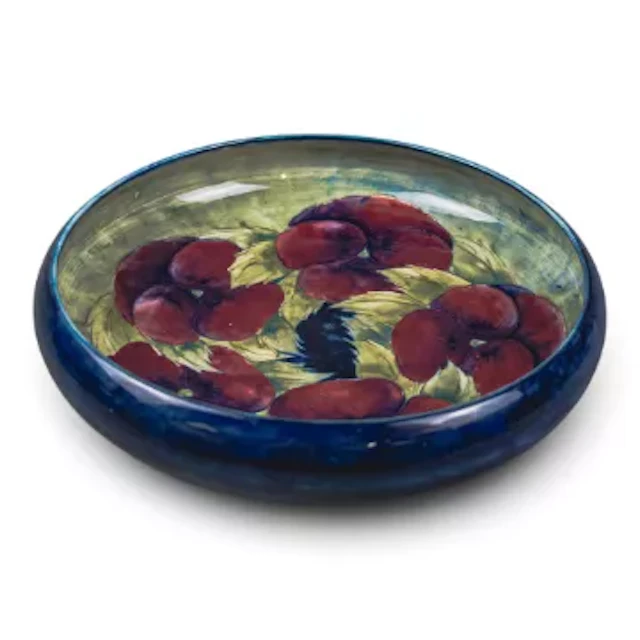 A large Moorcroft bowl in an early version of the Pansy design by