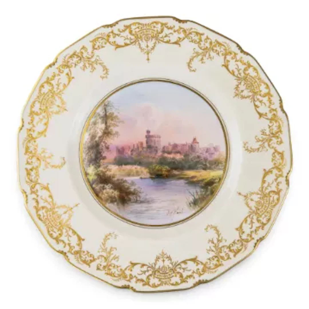 A Royal Doulton plate ornately decorated, featuring Windsor Castle