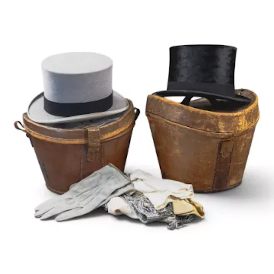 Two top hats, both in vintage leather hat cases, a grey hat with black