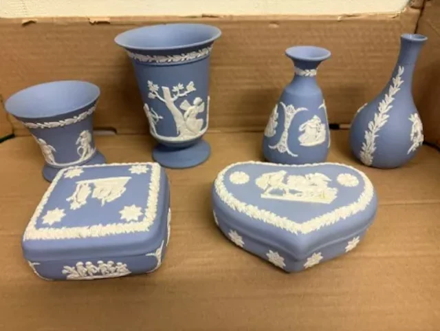 A collection of Wedgwood powder blue jasperware items to include vases
