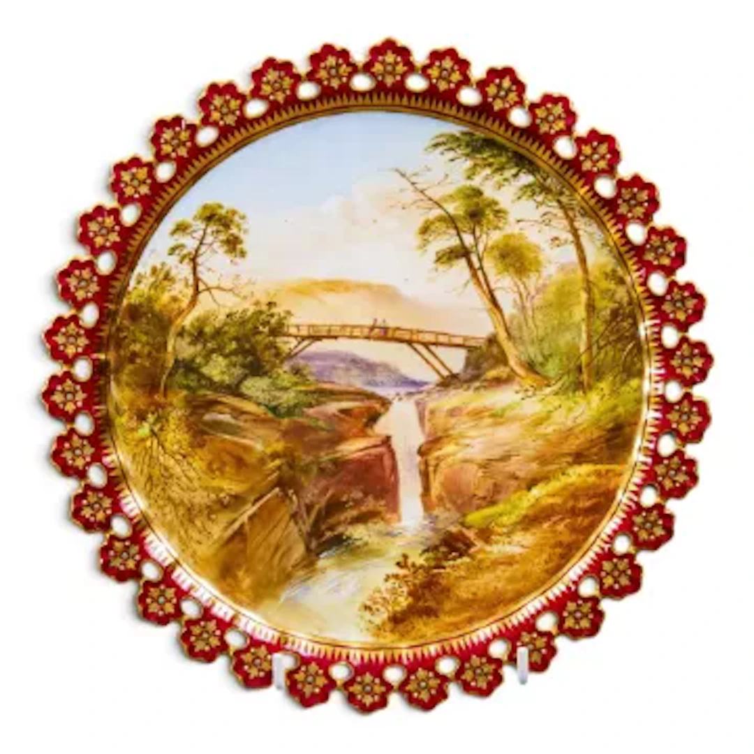 A 19th Century Coalport hand painted plate, with cut and pierced rim