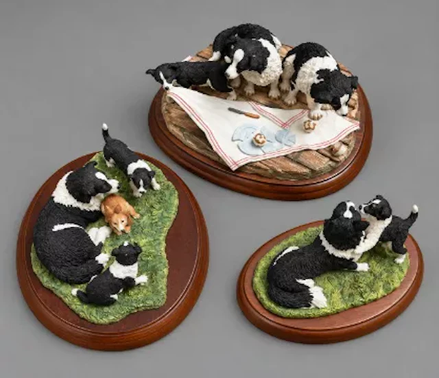A trio of Border Fine Arts resin sculptures raised on hardwood plinths