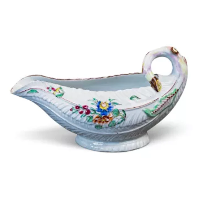 A Worcester polychrome lettuce leaf moulded sauce boat, c1765-70
