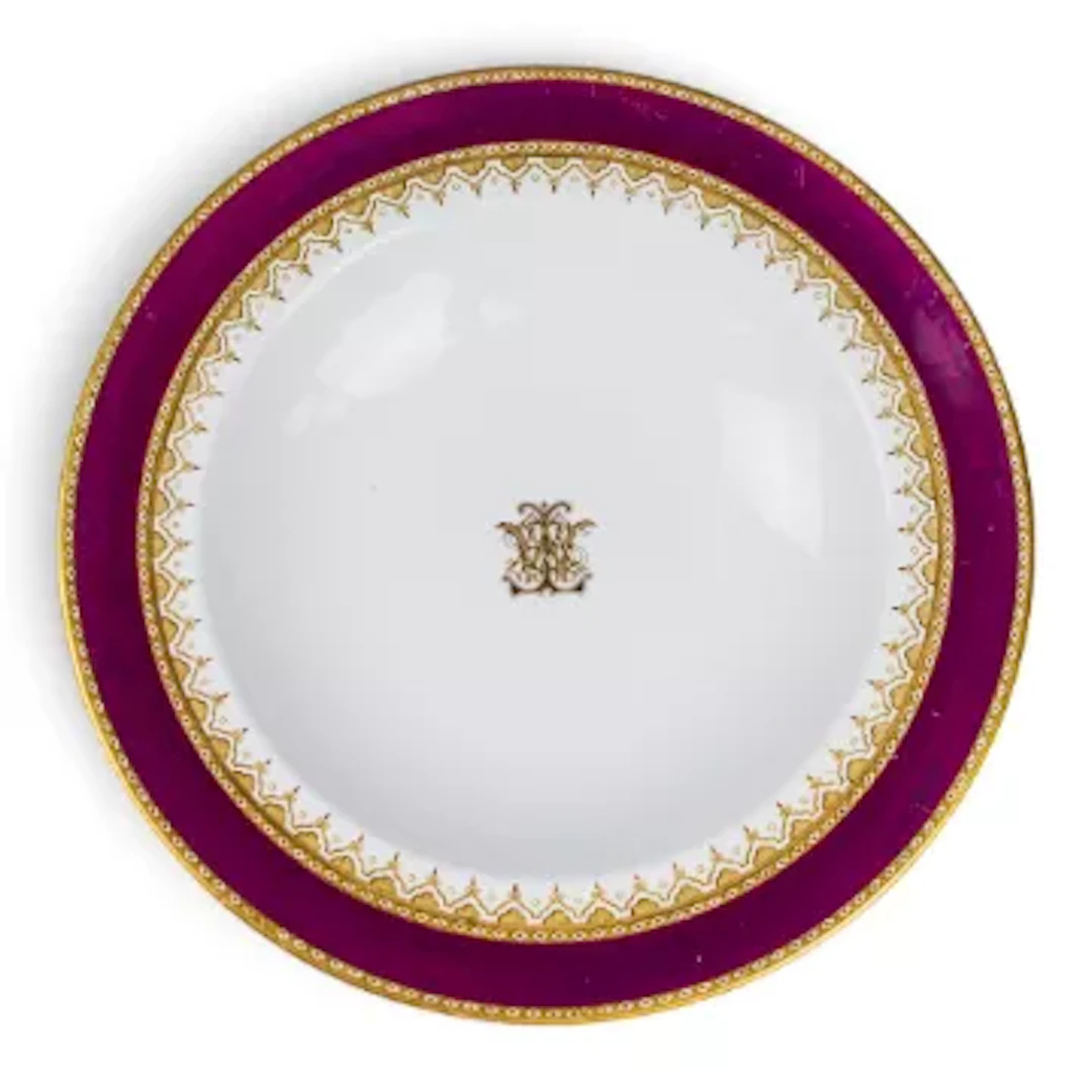 A Royal Worcester 19th century armorial shallow dish, with a burgundy