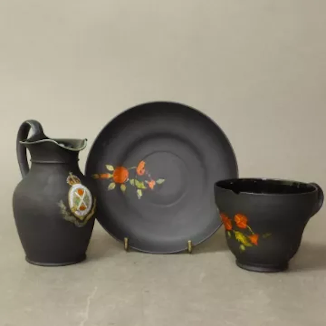 Wedgwood Kenlock Ware black basalt tea cup and saucer set with enamel