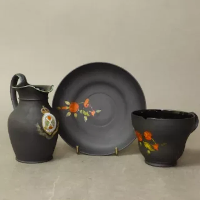 Wedgwood Kenlock Ware black basalt tea cup and saucer set with enamel
