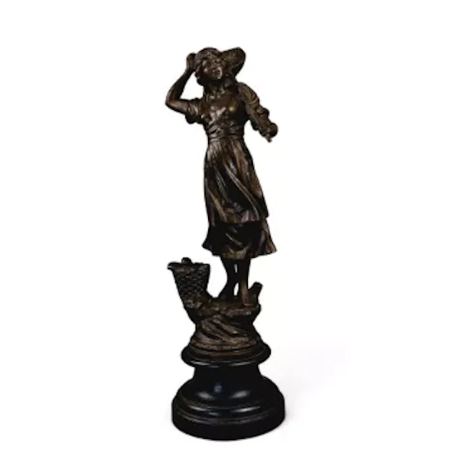 A Spelter figure 'The Farmers daughter' based on an earlier original