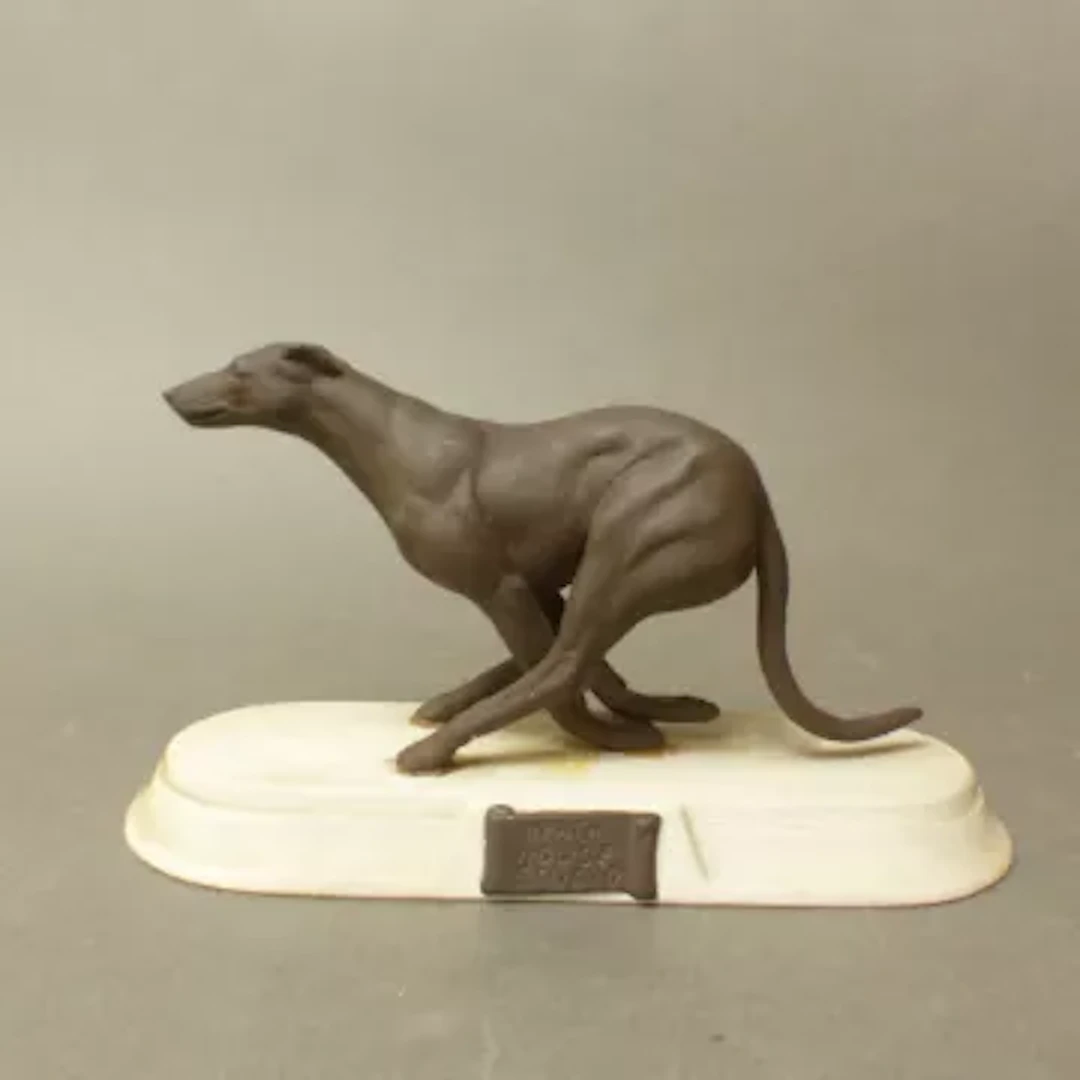Heath House Studio Pottery figure of a greyhound, length 18.5cm.