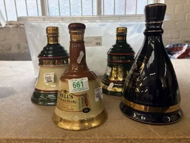 Four Bell's sealed scotch whisky decanters including, HM Queen Elizabeth