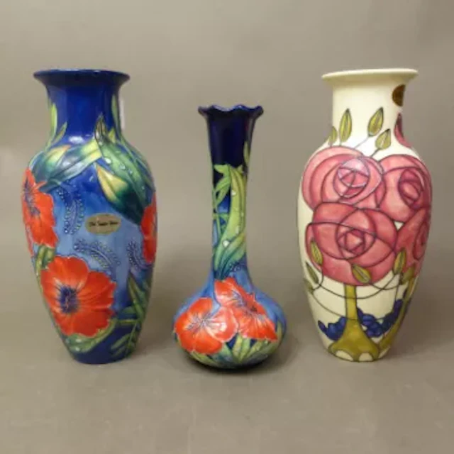 A trio of Old Tupton Ware tubelined floral vases, height of tallest 23cm (3).