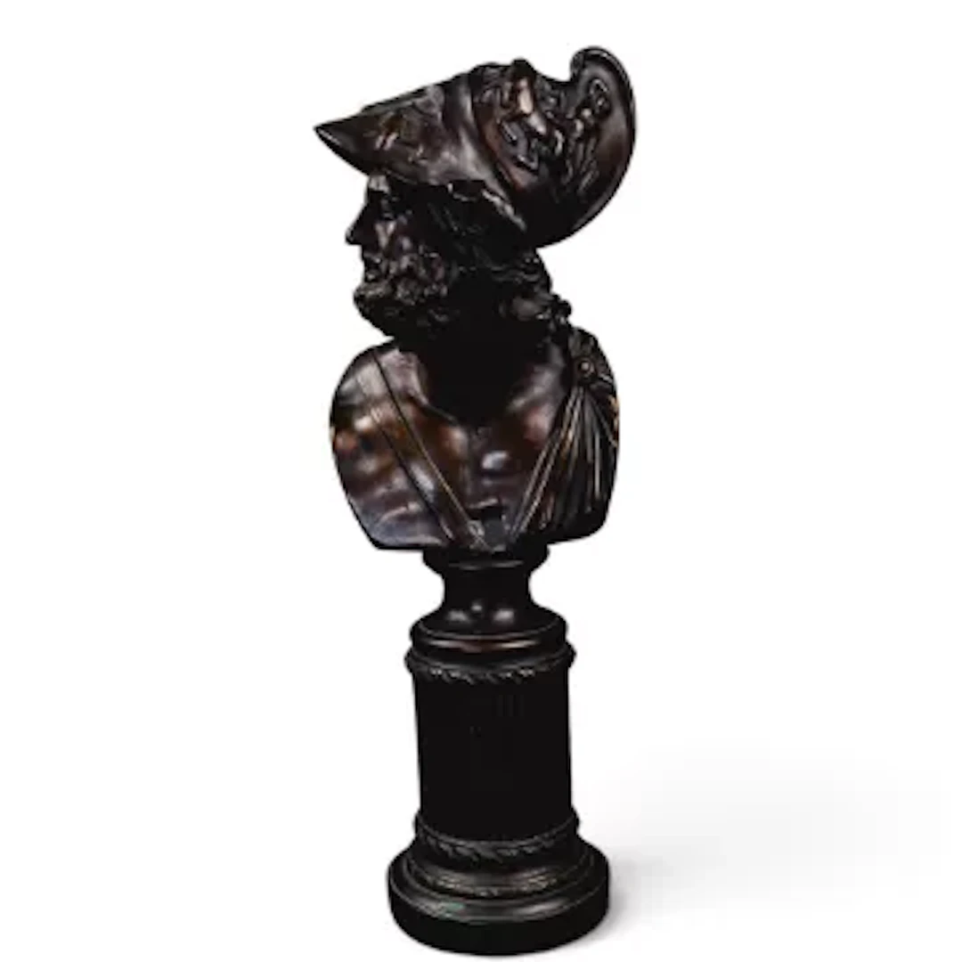 A bronze bust of Greek hero Melenaus, on patterned cylindrical plinth.