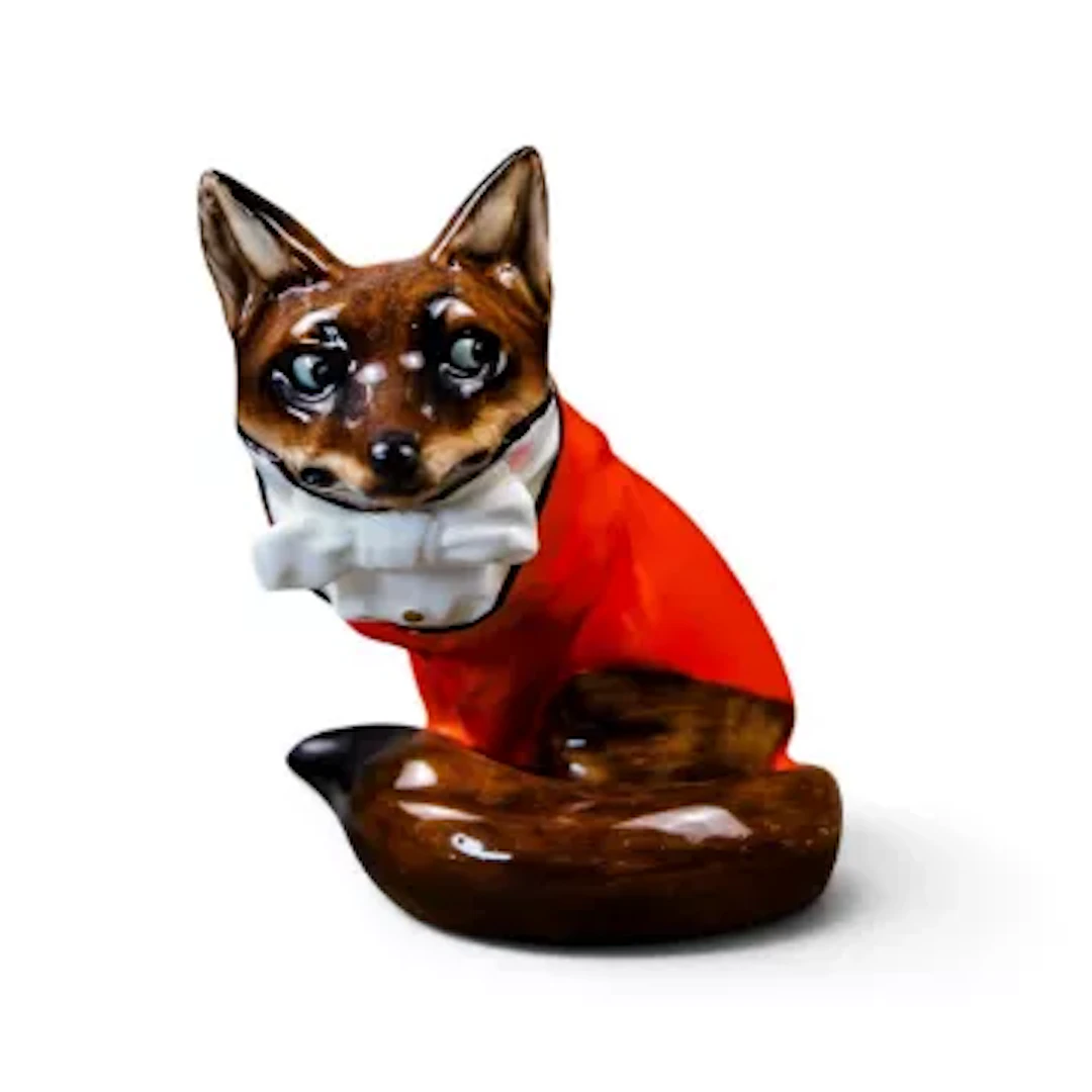 A Royal Doulton fox in hunting dress HN100, by Charles Noke. h.15.5cm