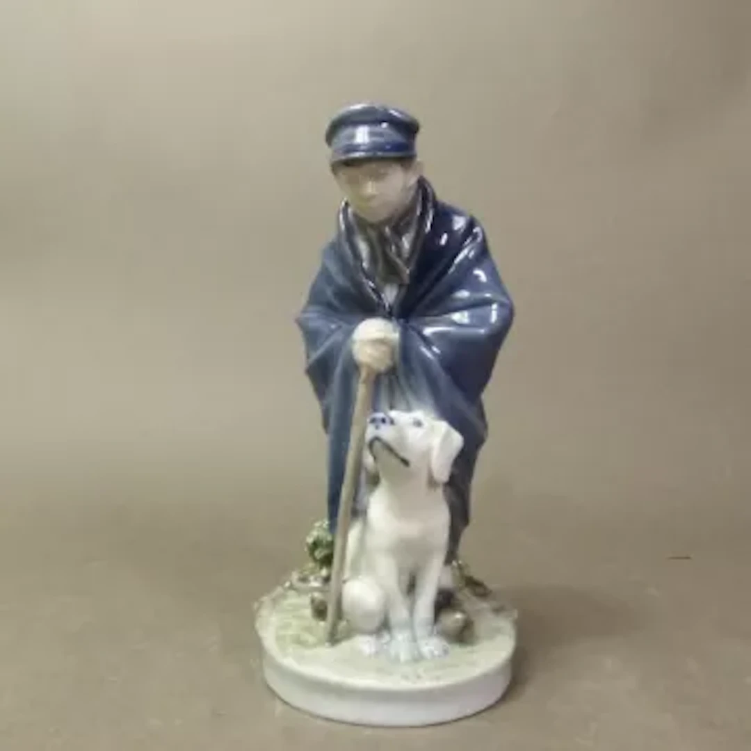 Royal Copenhagen figure shepherd with dog model 782, height 17cm.