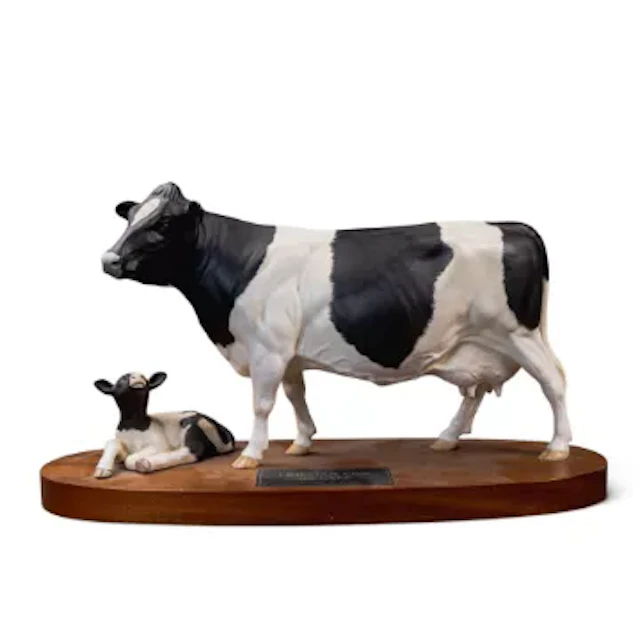 A Beswick Connoisseur model of a Friesian cow and calf, mounted on