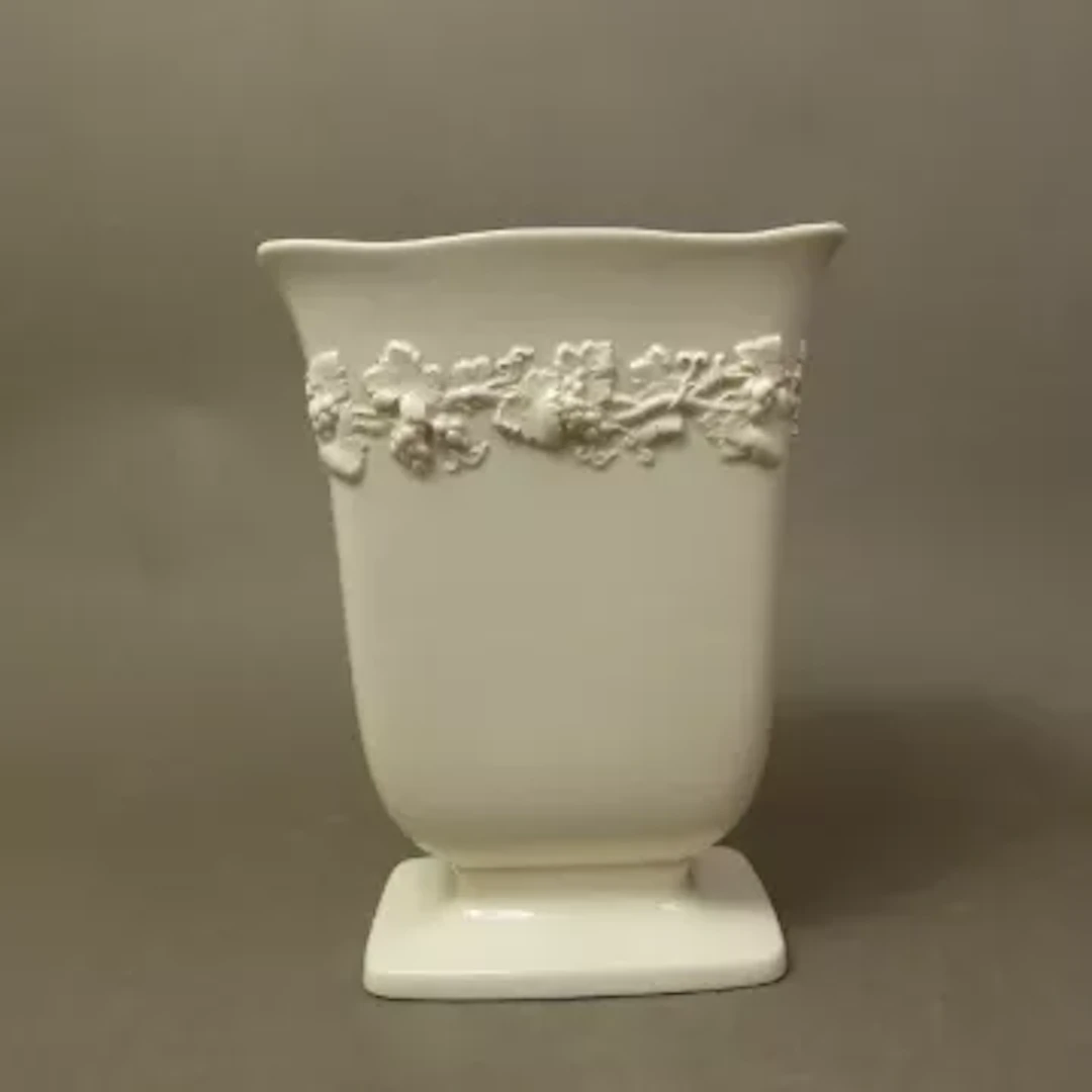 Wedgwood embossed Queens Ware rectangular footed vase. 20cm Height.