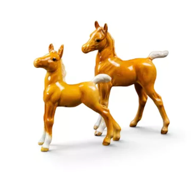 Two Beswick early version Palomino foals, to include small foal facing
