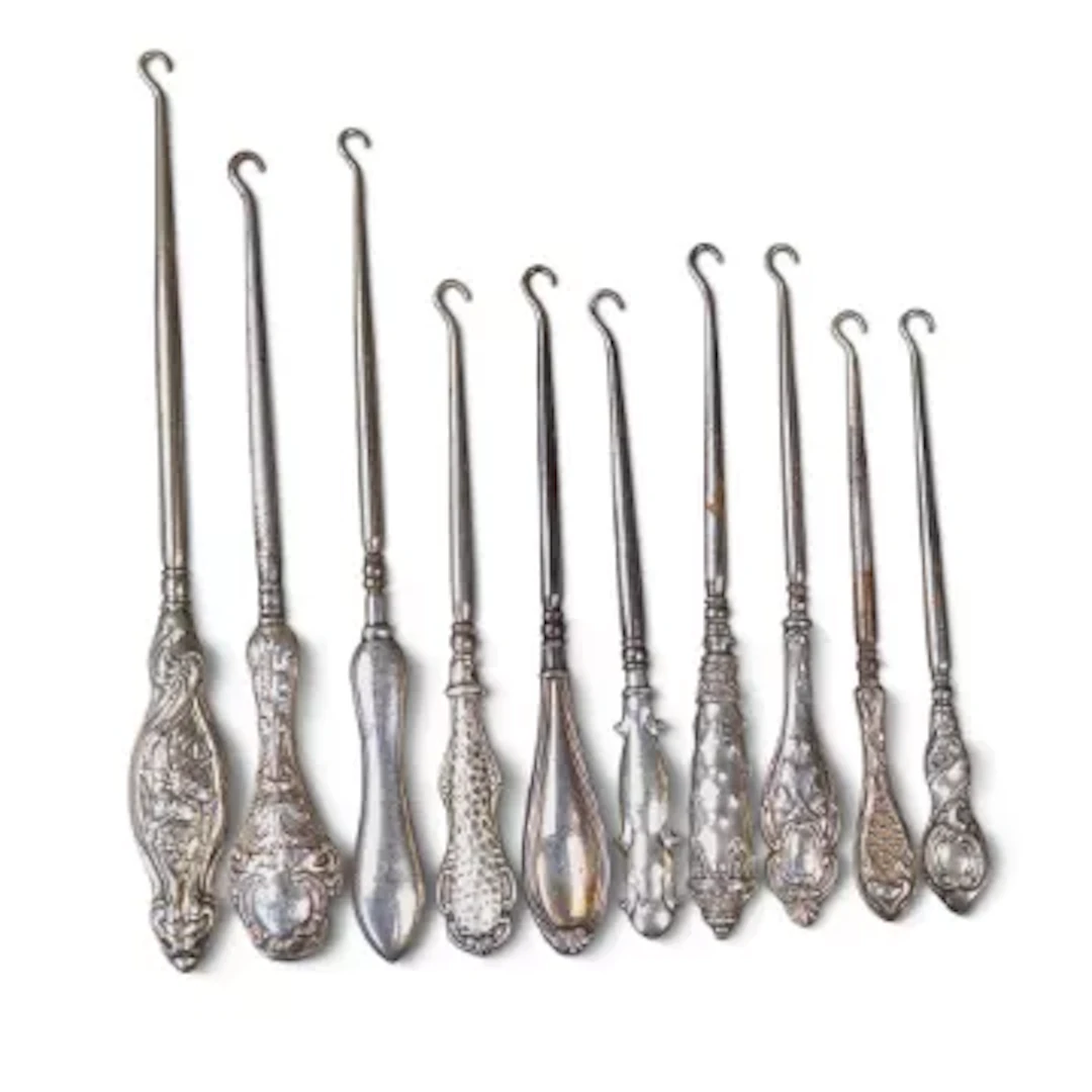 10 x hallmarked silver handled (loaded) button hooks, part of a large
