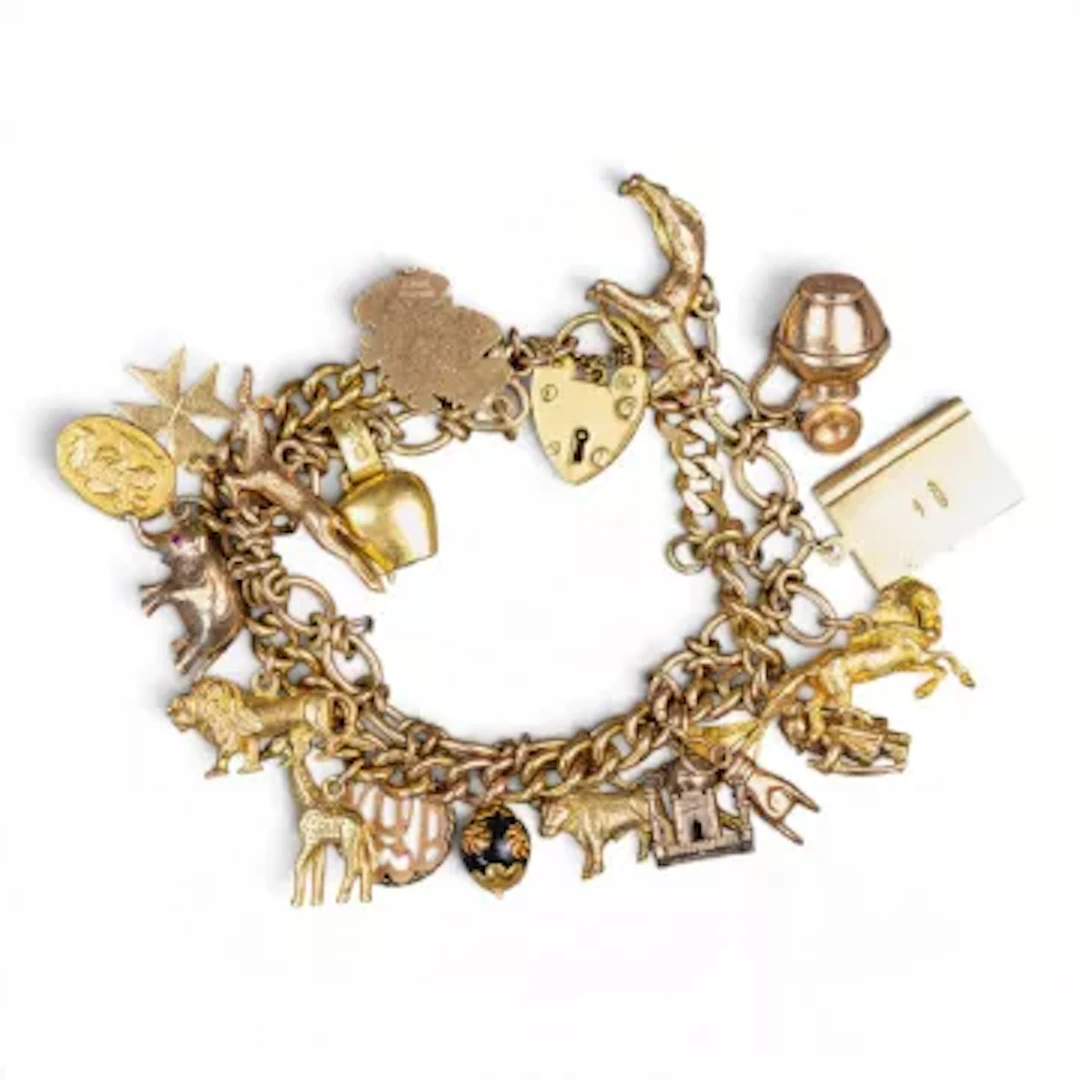9ct gold charm bracelet, set with 18 yellow metal charms, all electronically