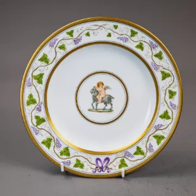 A Wedgwood plate, with central medallion featuring a hand painted