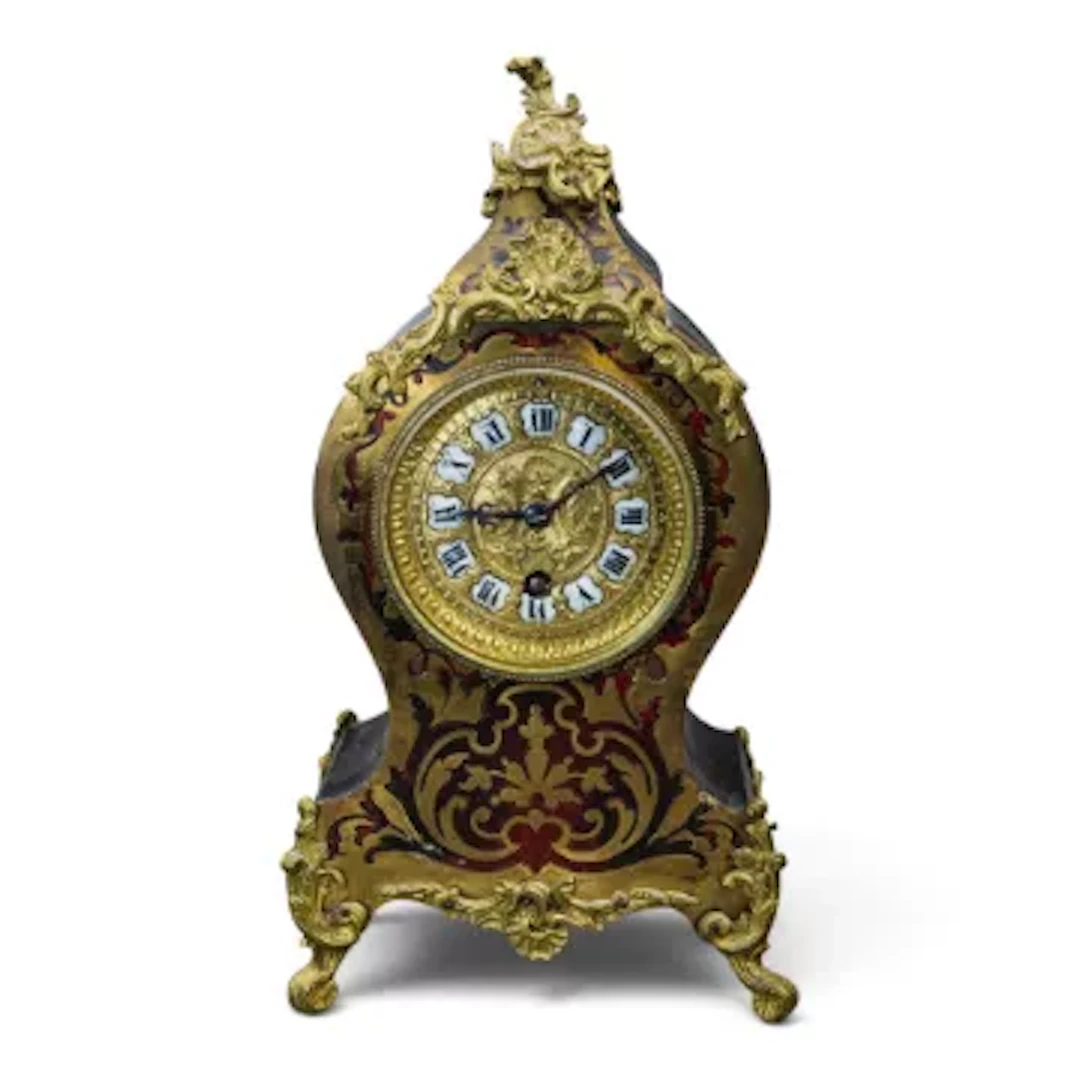 A 19th century 4 footed French Boulle mantle clock, with brass inlaid