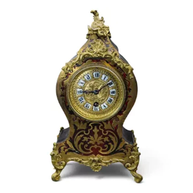 A 19th century 4 footed French Boulle mantle clock, with brass inlaid