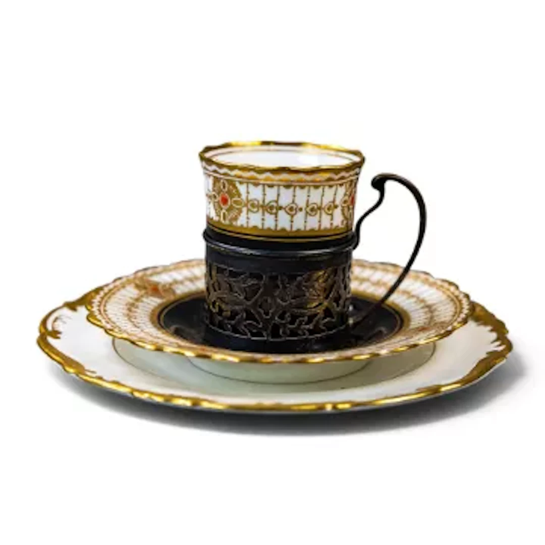 Aynsley China demitasse cup nestled in a hallmarked silver decorative