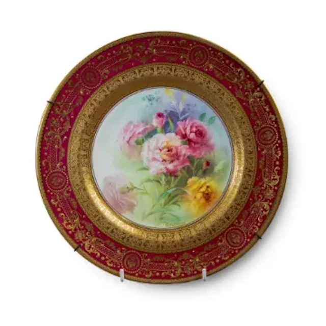 An Early 20th Century Royal Doulton plate, decorated with a floral