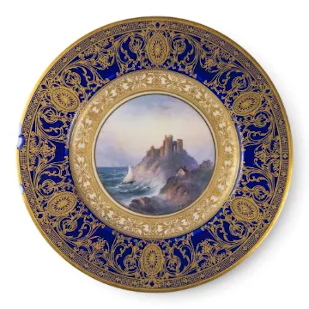 A Royal Worcester plate ornately decorated, featuring Criccieth Castle