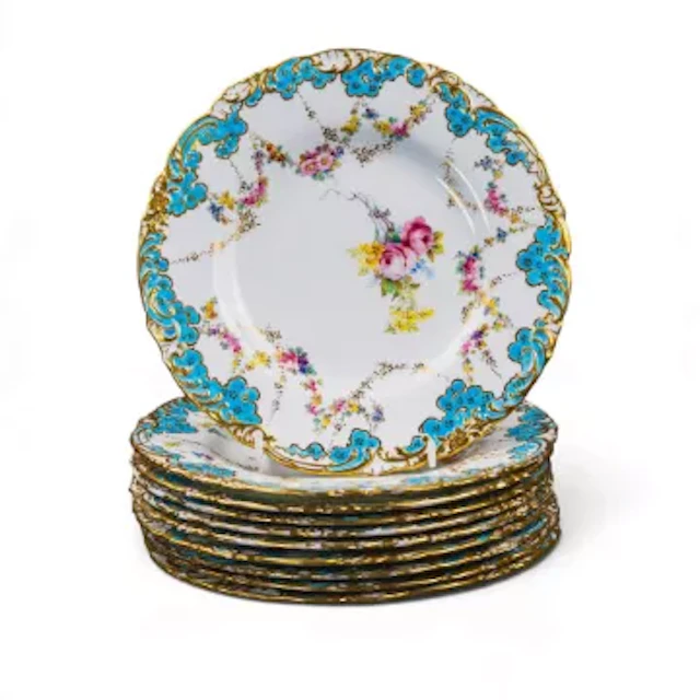 A set of 10 Royal Crown Derby dessert plates all decorated with a