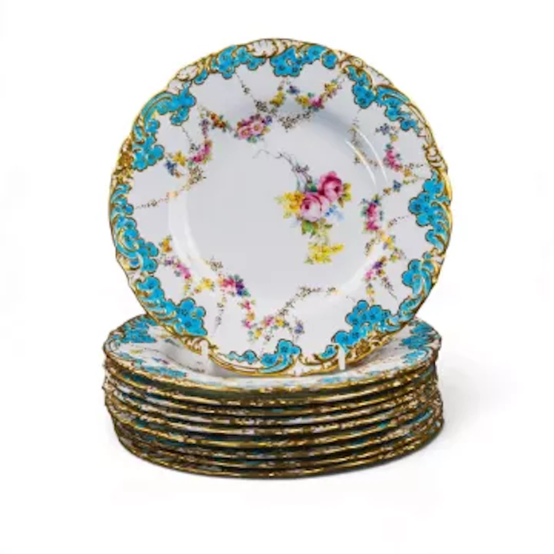 A set of 10 Royal Crown Derby dessert plates all decorated with a