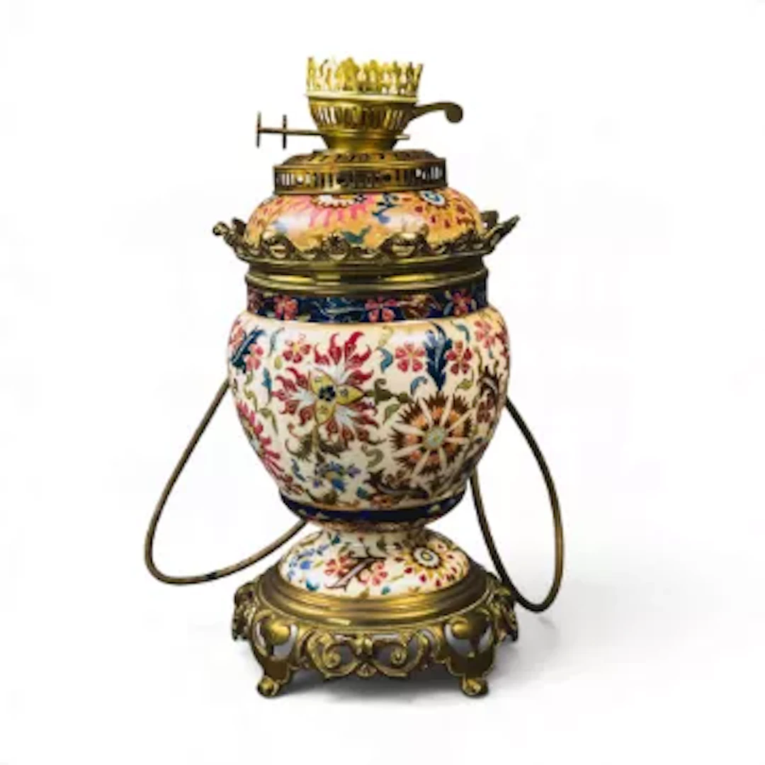 A Hungarian porcelain oil lamp, probably by Ignac Fischer, early 20th