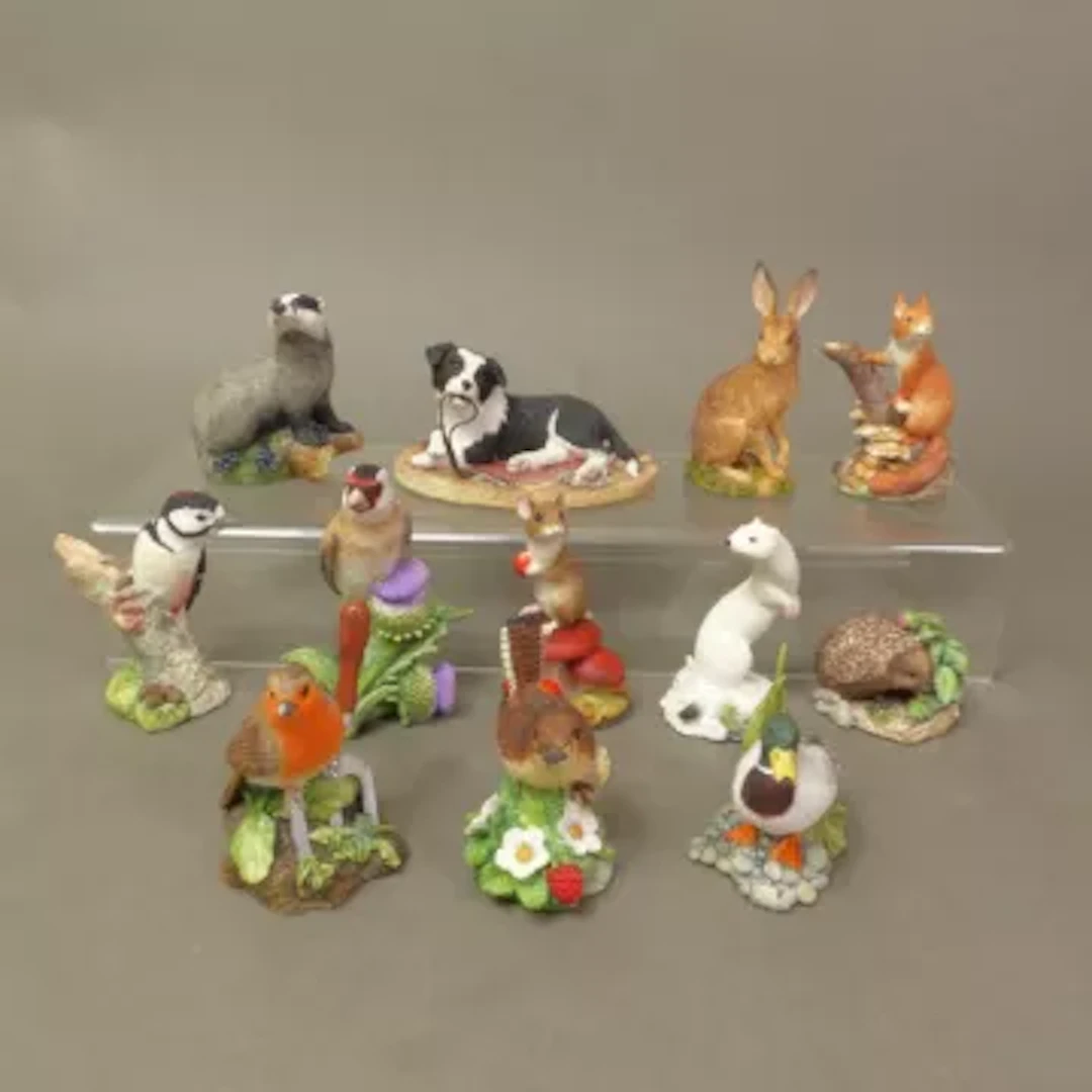 A collection of 12 Border Fine Arts small resin sculptures, Walkies