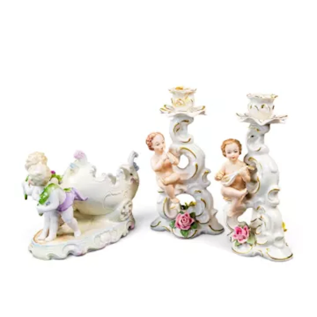 Three Continental porcelain pieces to include a near pair of candleholders