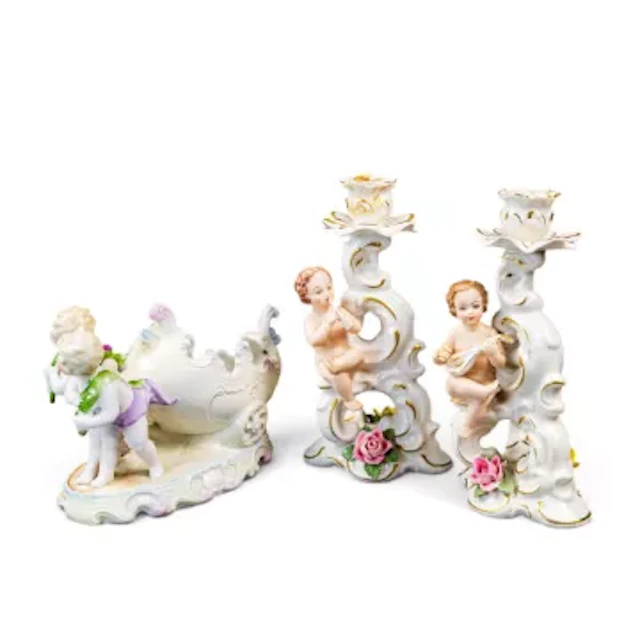 Three Continental porcelain pieces to include a near pair of candleholders