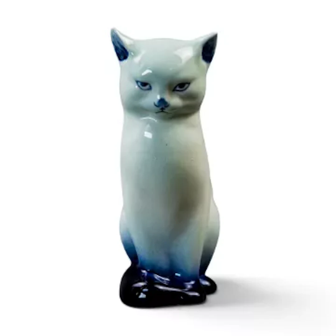 A Royal Doulton rare pre flambe model of a seated cat, model number